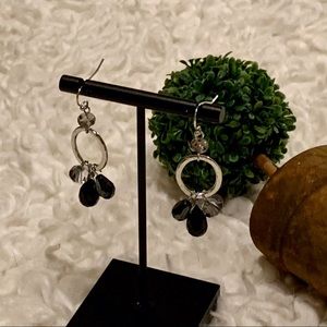 Dangle earrings with clear, black and grey stones.